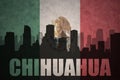 Abstract silhouette of the city with text Chihuahua at the vintage mexican flag