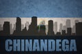 Abstract silhouette of the city with text Chinandega at the vintage nicaraguan flag