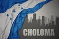 Abstract silhouette of the city with text Choloma near waving national flag of honduras on a gray background. 3D illustration