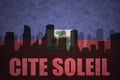 Abstract silhouette of the city with text Cite Soleil at the vintage haitian flag