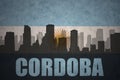 Abstract silhouette of the city with text Cordoba at the vintage argentinean flag