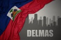 Abstract silhouette of the city with text Delmas near waving national flag of haiti on a gray background. 3D illustration