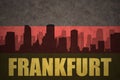 Abstract silhouette of the city with text Frankfurt at the vintage german flag