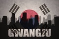 Abstract silhouette of the city with text Gwangju at the vintage south korea flag