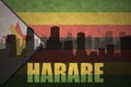 Abstract silhouette of the city with text Harare at the vintage zimbabwean flag
