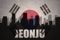 Abstract silhouette of the city with text Jeonju at the vintage south korea flag