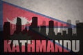 Abstract silhouette of the city with text Kathmandu at the vintage nepal flag Royalty Free Stock Photo