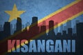 Abstract silhouette of the city with text Kisangani at the vintage democratic republic of the congo flag