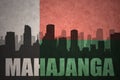 Abstract silhouette of the city with text Mahajanga at the vintage madagascar flag Royalty Free Stock Photo