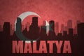 Abstract silhouette of the city with text Malatya at the vintage turkish flag