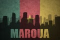 Abstract silhouette of the city with text Maroua at the vintage cameroon flag Royalty Free Stock Photo