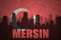 Abstract silhouette of the city with text Mersin at the vintage turkish flag