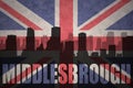 Abstract silhouette of the city with text Middlesbrough at the vintage british flag