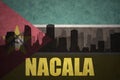 Abstract silhouette of the city with text Nacala at the vintage mozambican flag Royalty Free Stock Photo