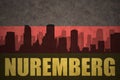 Abstract silhouette of the city with text Nuremberg at the vintage german flag