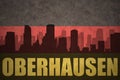 Abstract silhouette of the city with text Oberhausen at the vintage german flag