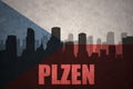 Abstract silhouette of the city with text Plzen at the vintage czech republic flag