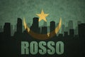 Abstract silhouette of the city with text Rosso at the vintage mauritania flag