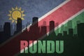 Abstract silhouette of the city with text Rundu at the vintage namibian flag