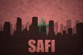 Abstract silhouette of the city with text Safi at the vintage moroccan flag