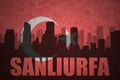 Abstract silhouette of the city with text Sanliurfa at the vintage turkish flag