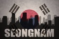 Abstract silhouette of the city with text Seongnam at the vintage south korea flag