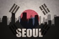 Abstract silhouette of the city with text at Seoul the vintage south korea flag