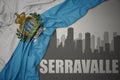 Abstract silhouette of the city with text serravalle near waving national flag of san marino on a gray background