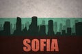 Abstract silhouette of the city with text Sofia at the vintage bulgarian flag