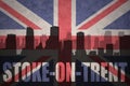 Abstract silhouette of the city with text Stoke-on-Trent at the vintage british flag