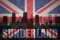 Abstract silhouette of the city with text Sunderland at the vintage british flag