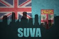 Abstract silhouette of the city with text Suva at the vintage Fiji flag