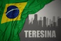 Abstract silhouette of the city with text Teresina near waving national flag of brazil on a gray background