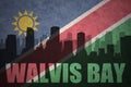 Abstract silhouette of the city with text Walvis Bay at the vintage namibian flag