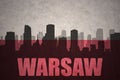 Abstract silhouette of the city with text Warsaw at the vintage polish flag
