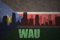 Abstract silhouette of the city with text Wau at the vintage south sudan flag