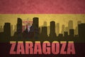 Abstract silhouette of the city with text Zaragoza at the vintage spanish flag