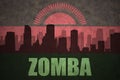 Abstract silhouette of the city with text Zomba at the vintage malawi flag