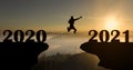 Abstract silhouette of man jump to New year 2021