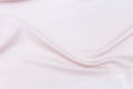 Abstract silky waving pink fabric background