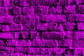 Abstract purple background with brick wall texture. Brickwork close-up.