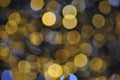 Gold festive glitter background with defocused lights.Abstract gold circular bokeh background of christmas light gold Royalty Free Stock Photo