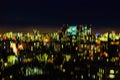 Abstract skyscrapers at night. Modern neon city, light bokeh, blurred focus, modern background Royalty Free Stock Photo