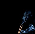 Smoke of joss stickon black background Royalty Free Stock Photo