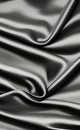 Abstract smooth elegant black fabric silk texture soft background, flowing satin waves. Dark gray fabric silk texture close up. Royalty Free Stock Photo