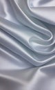 Abstract smooth elegant white fabric silk texture soft background, flowing satin waves. Gray, silver fabric silk texture close up. Royalty Free Stock Photo