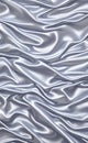 Abstract smooth elegant white fabric silk texture soft background, flowing satin waves. Gray, silver fabric silk texture close up. Royalty Free Stock Photo