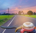 Abstract soft blurred the silhouette the sunrise, the road, the green paddy rice field with the beautiful sky and cloud in the eve Royalty Free Stock Photo