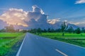 Abstract soft blurred and soft focus the silhouette the sunrise with the road, paddy rice field,the beautiful sky and cloud in Tha Royalty Free Stock Photo