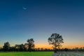 Abstract soft blurred and soft focus the silhouette of the sunset with the paddy rice field ,the straw after harvest and the beau Royalty Free Stock Photo